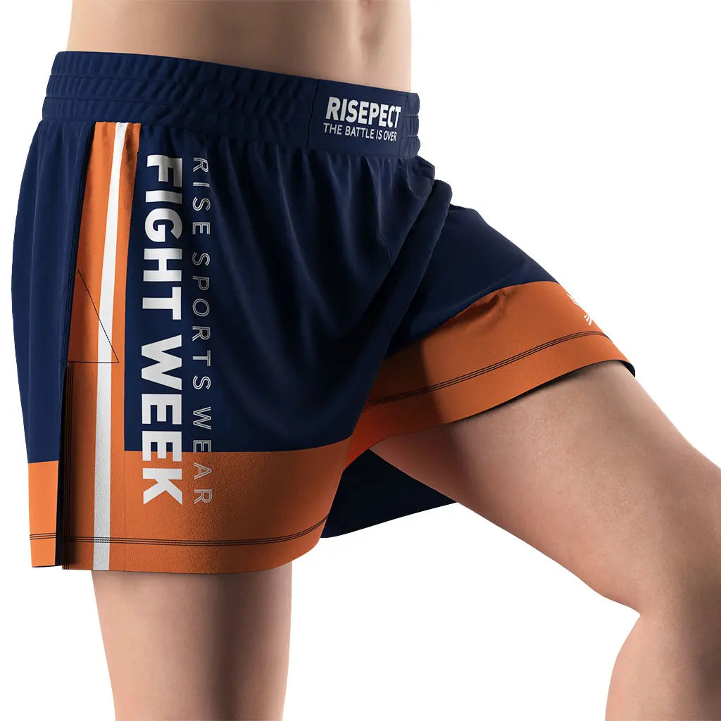 Male Model in Orange High Slit Battle Week BJJ MMA Hybrid Shorts Right Front View