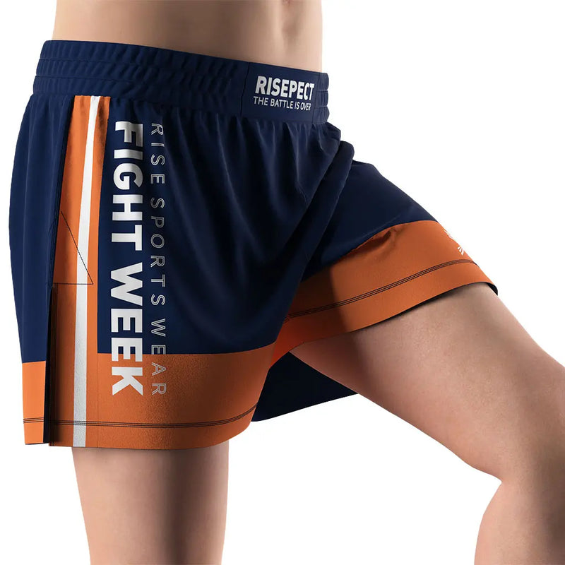 Male Model in Orange High Slit Battle Week BJJ MMA Hybrid Shorts Right Front View