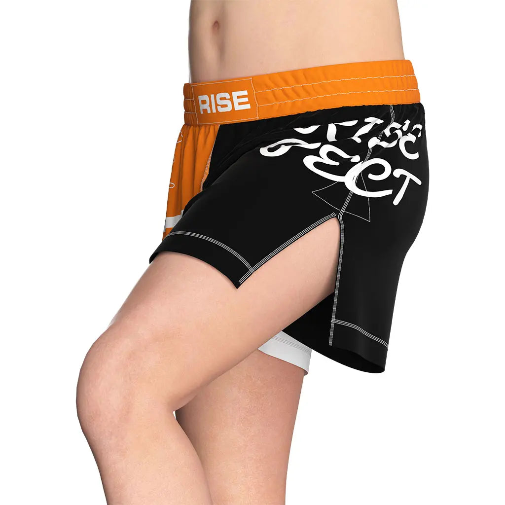 Male Model in Orange High Slit Ignite Line BJJ MMA Hybrid Shorts Left Front View